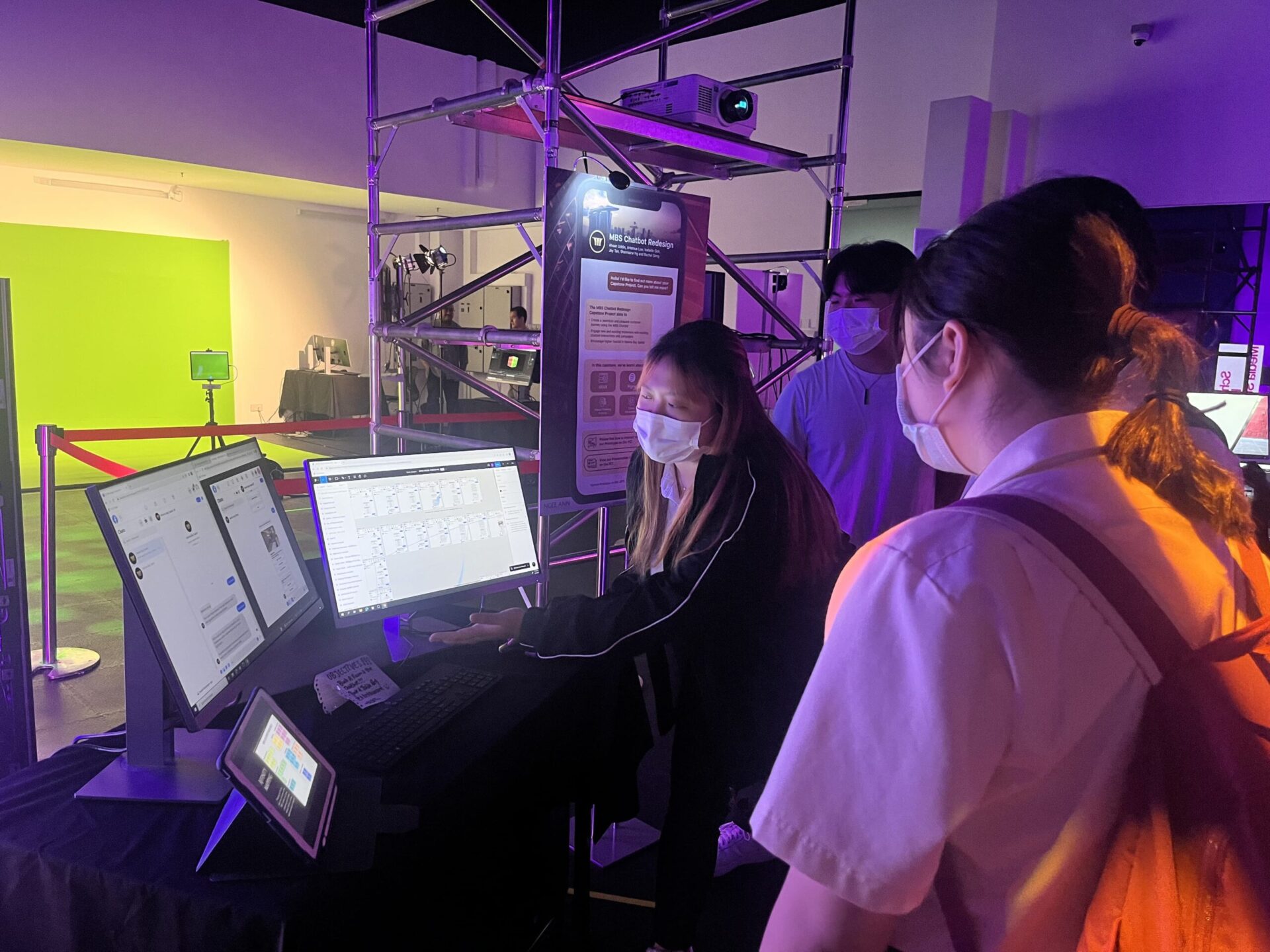 The team's booth showcasing the final product and work of the chatbot