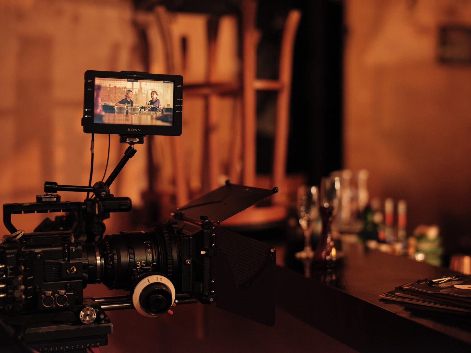 A warm image of a camera in a bar that acts as a hero image for Film, Sound & Video diploma.